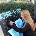 Student participating in Buck-A-Brick